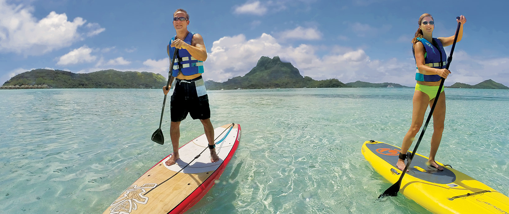 Paddleboarding at our White Sand Beach in Bora Bora