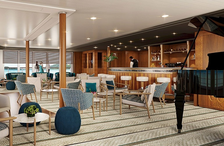Dining area containing a grand piano, teak-wood bar, and many seating arrangements.